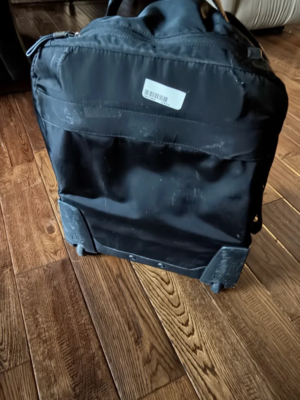 Tumi Black Travel Backpack with Gold Zipper Accents